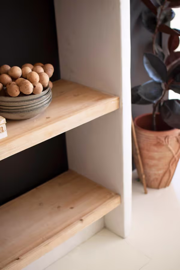Textured Shelving Unit with Four Wooden Shelves