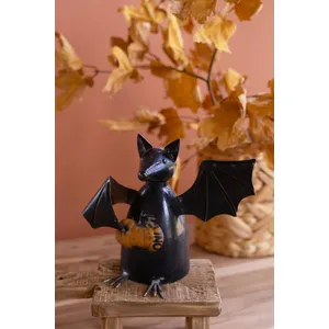 Recycled Metal Bat Holding a Pumpkin 1