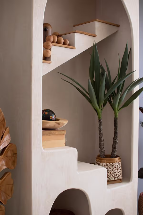 Textured Arched Shelving Unit with Stairs Detail