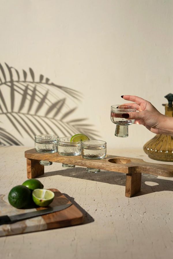 Tequila Flight with Four Glasses on a Wooden Tray