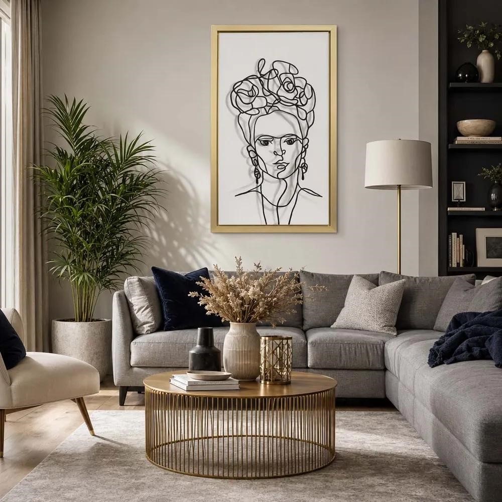 Tall vertical black and gold framed canvas hung at eye level on a large white living room wall