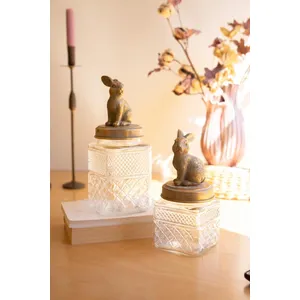 Set of 2 Resin and Glass Rabbit Canisters 1