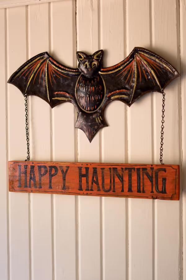Hand-Hammered Painted Metal Bat with Happy Haunting Sign Wall Hanging